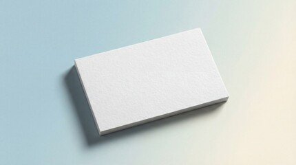 A stack of blank, premium white business cards made of thick cotton paper is presented in a studio product shot. The cards cast a soft, subtle shadow on a minimalist pastel background that subtly