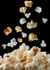  delicious popcorn isolated on black background