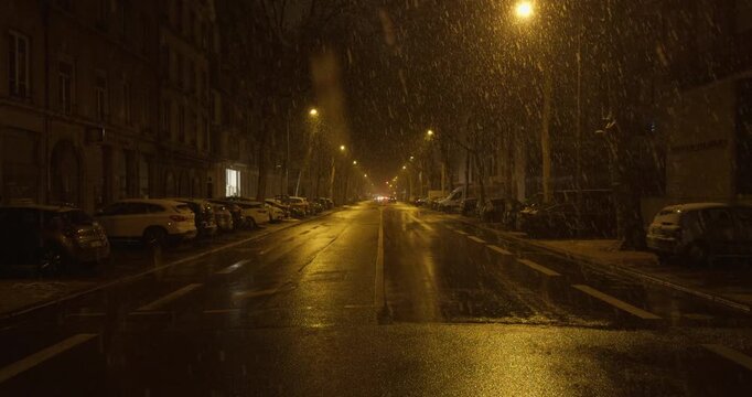 night traffic in the city under the rain