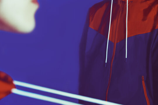 Close Up of Red and Blue Sportswear Windrunner Jacket with Logo