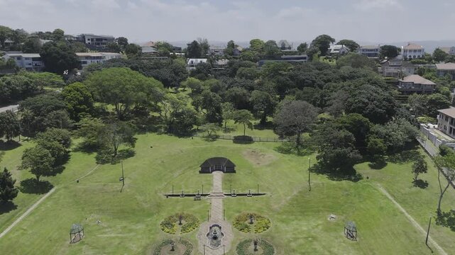 Drone lowers in Jameson Park on sunny day in Morningside neighborhood in Durban, South Africa