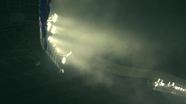 Football stadium Lights against Dark Night Sky with moving fog, sport background