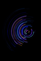 A long exposure photograph. Light painting photography, vibrant fairy lights against a black background
