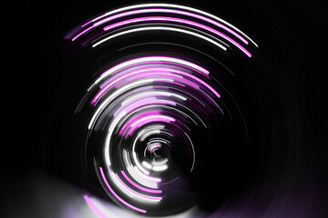 A long exposure photograph. Light painting photography, vibrant fairy lights against a black background