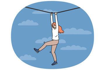 Frightened woman faces risk and danger as she navigates way along rope suspended high in sky. Young girl experiences fear and horror but fights challenge on path to success despite risk