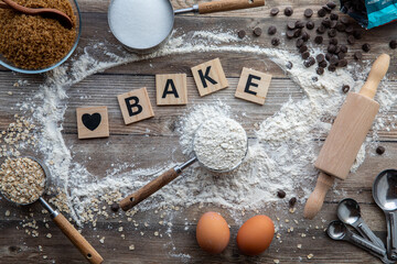 A baking concept background using different ingredients and utensils.