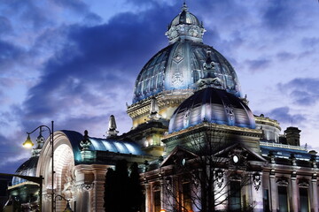 CEC Palace historical building on Calea Victoriei boulevard in Bucharest at dusk