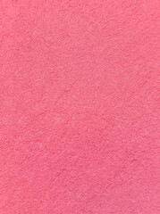 Fototapeta premium Pink concrete wall texture background with rough painted surface