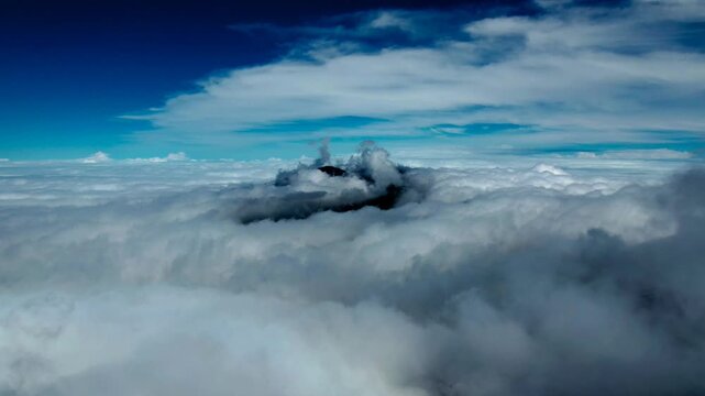 Aerial Hyperlapse Above Clouds and Mountain Peak