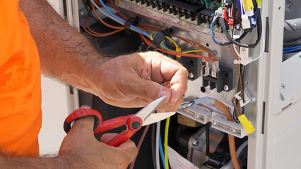 Skilled electrical workers wiring a residential villa during home renovation project