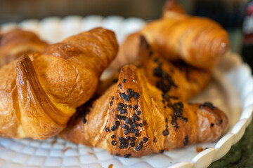Assorted cornetti displayed for breakfast with crispy layers and gourmet presentation