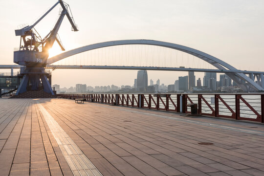 shanghai sunset lupu bridge and crane