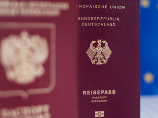 Russian Passport Blurred in Front of EU Flag Symbolizing German Citizenship