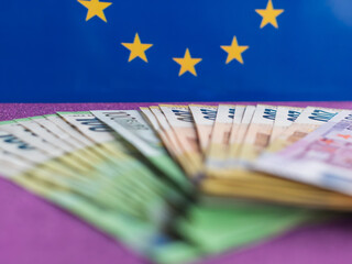 European Currency with Euro Banknotes and Flag