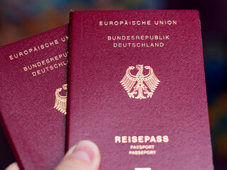 German Passports Held in Hand with Detail