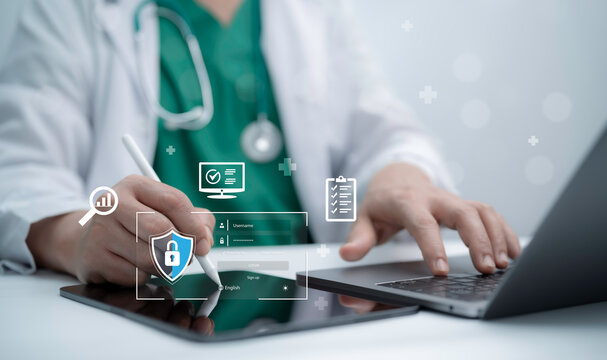 Doctor using digital tablet and laptop with medical data security interface showing cybersecurity protection for healthcare technology electronic health records patient privacy - Powered by Adobe