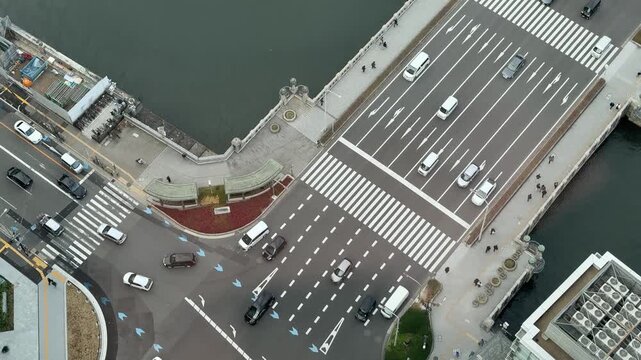 Aerial view of busy traffic flowing through 8-lane Midosuji Avenue in Shinsaibashi, Osaka, Japan