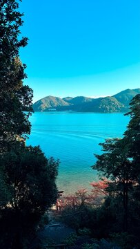 Scenic view of the vast blue water of Lake Biwa on a sunny day