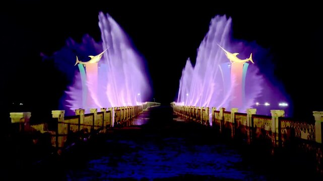 A dancing water show with sophisticated technology and a beautiful combination of colorful lights at the Siring Laut location in Kotabaru Regency, Indonesia.