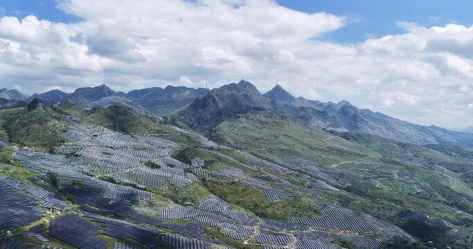 aerial video of  a massive solar farm on karst rocky desertification terrain in Guizhou, showcasing large-scale clean energy and ecological restoration.