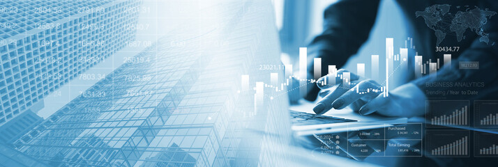 Business, finance and investment concept. Businessman using digital tablet analyzing financial data with economic graph growth chart, Business strategy and planning. market research