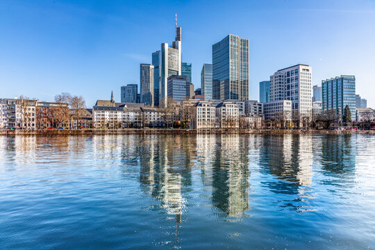 view to modern skyline of Frankfurt wit skyscraper and. with river Main in foreground