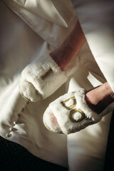 close up of wedding day slippers that say I do