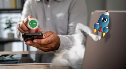 A person starting a task at desk, pressing start on a laptop or tablet, representing the beginning of digital workflow and focus.