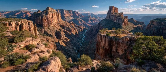 Vast canyon vista with layered rock walls, river winding through
