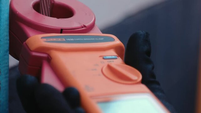 Close-Up of Ground Resistance Tester Being Used During Electrical Inspection