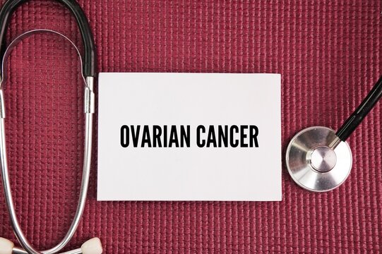 Stethoscope and white paper with word Ovarian cancer. when a cancerous tumor forms in the tissues of an ovary.