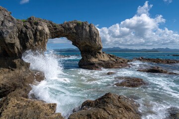 Coastal archway under a vibrant blue sky