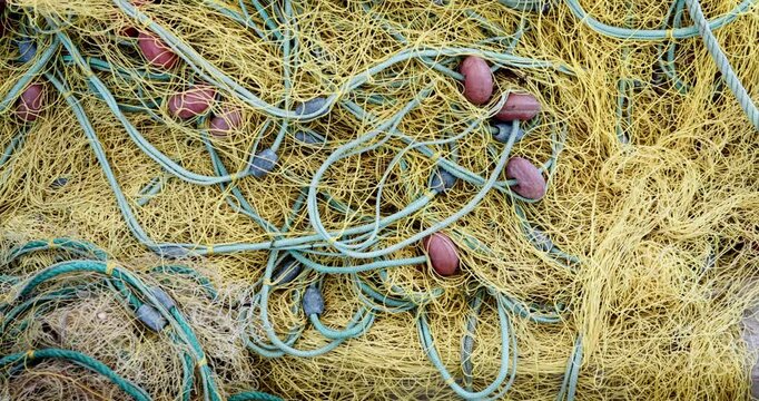 Sea nets - fishing equipment or tackle as texture backdrop with natural sunlight and shadow