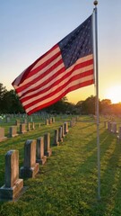 red white blue flag flying over weathered gray gravestones at sunset