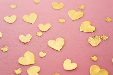 Fototapeta premium Golden heart confetti on pink background for valentine day