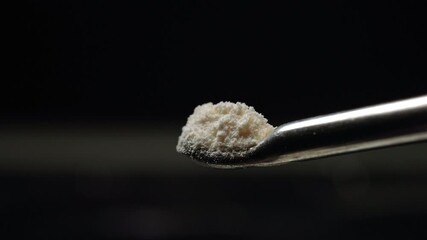 Display of fentanyl powder on medical spoon. Two milligrams of drug is lethal dose for people. On the streets fentanyl can be injected, snorted sniffed, smoked, taken orally by pill or tablet.