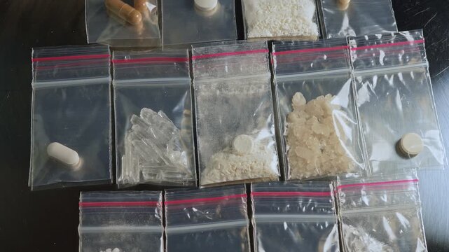 Fentanyl type opioid drugs display in small packages in powder crystals and capsules form. This drugs causing the most severe crisis in the world. Synthetic opioids, Fentanyl, Nitazenes, heroin.
