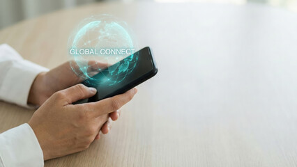 Business hand smartphone hologram global connect high level planning concept on wooden desk office background