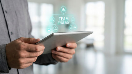 High level planning team synergy concept on digital tablet in modern office environment showing collaborative strategy workflow hologram display