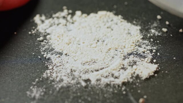 Drug dealer crushing prescription opioid drug to mix with fentanyl. Synthetic opioids and fentanyl crisis. On the streets it is injected, snorted sniffed, smoked, taken orally by pill or tablet.