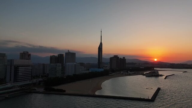 Fukuoka City, Japan at Sunset: 4K Aerial Drone Footage of Fukuoka Tower, Umisaki Park Beach, Hilton Fukuoka Sea Hawk, Mizuho PayPay Dome, City Skylines and Coastal Evening Views
