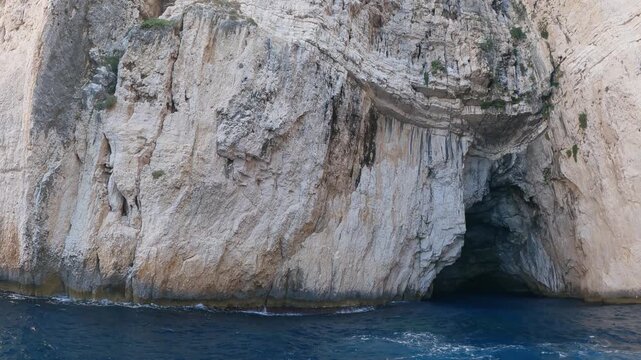 Amazing landscape. The Blue Cave: three exceptional sea caves which are communicating each other. They owe their name to the variety of shades of blue and to the clear waters. Paxos island. Greece.