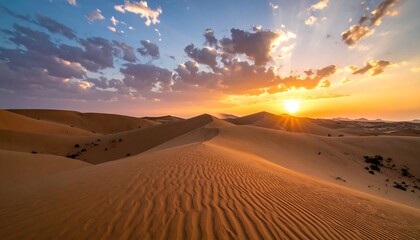 Vast desert landscape at sunrise, with sand dunes rippling toward the horizon under a vibrant sky with scattered clouds and radiant sunlight