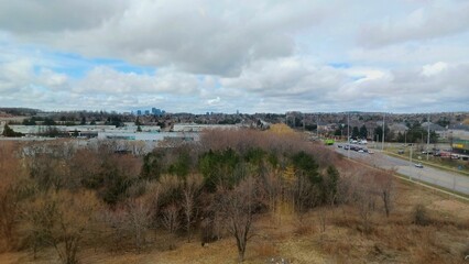 Suburban landscape under cloudy sky.