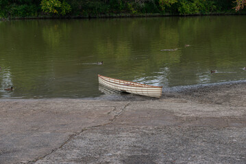 Small boat on river bank