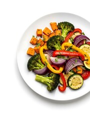 Exquisite plate of mixed roasted vegetables arranged against a white backdrop