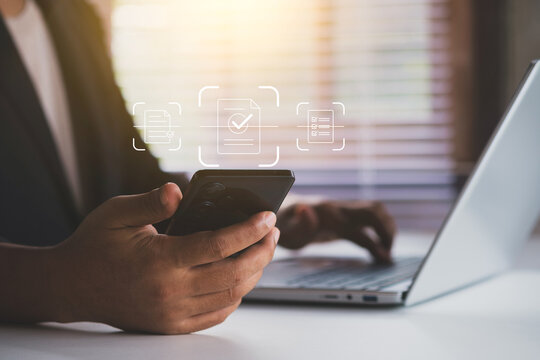 Mobile OCR document scanning technology for digital paperwork management, showing business professional using smartphone to capture paper documents and convert them into searchable digital data - Powered by Adobe