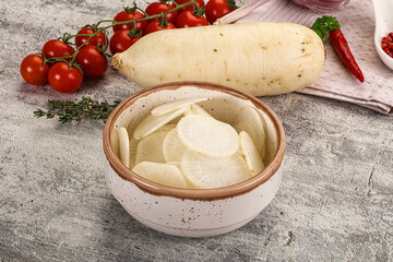 Sliced white daikon radish in the bowl