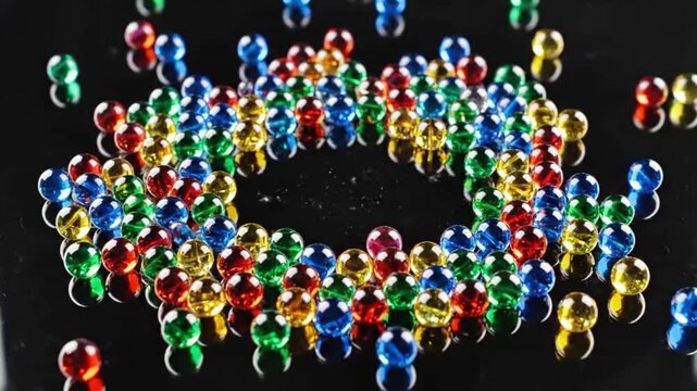 Colorful Magnetic Balls Arranged in a Circular Pattern.