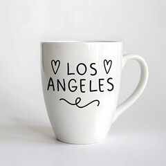 a white coffee mug with the word los angeles